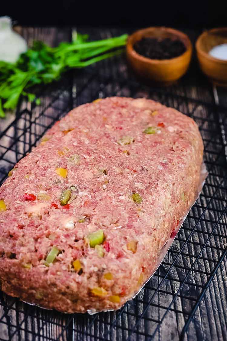 Meatloaf with a leave-in thermometer, cooking on the grill