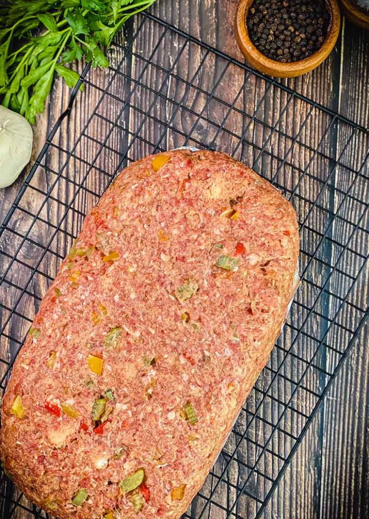ground beef with vegetables formed into a loaf for smoking