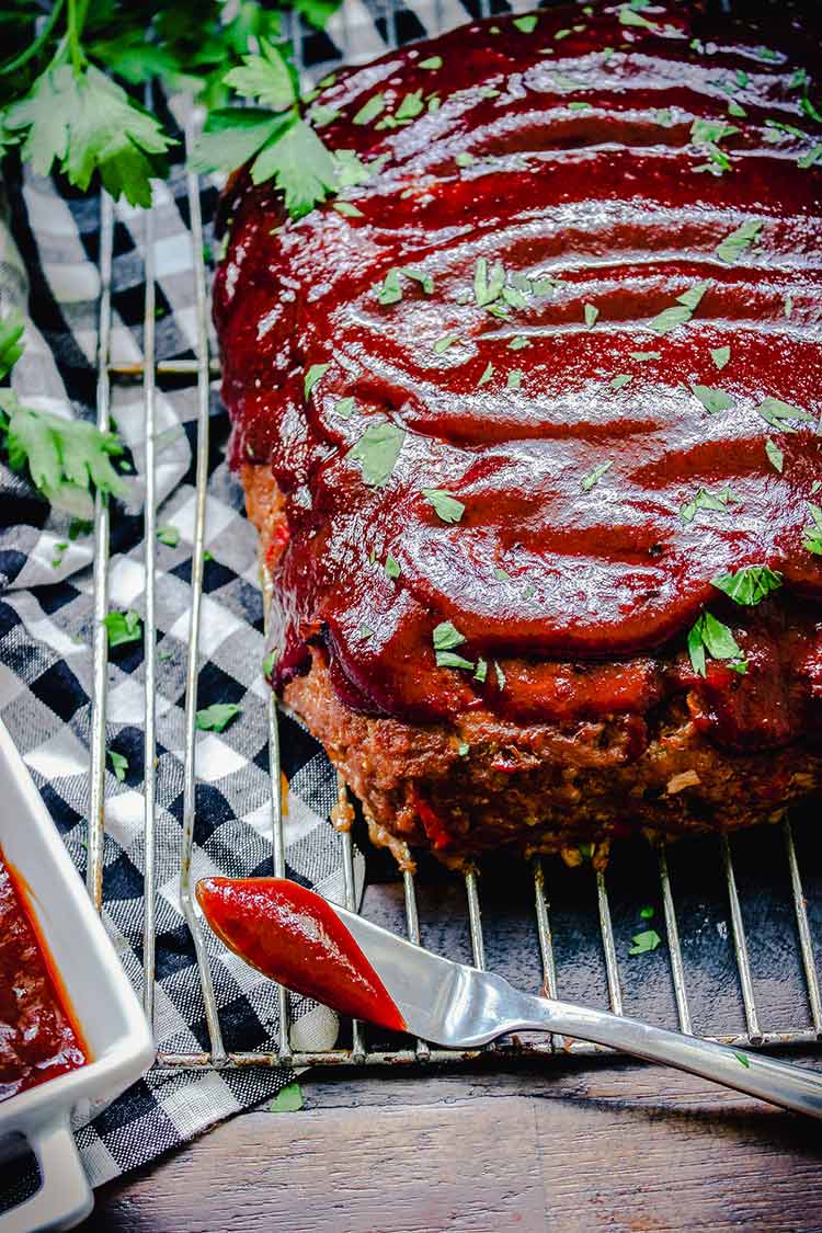 meatloaf spread with barbecue sauce and cooling
