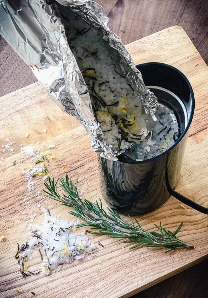 Pouring roasted ingredients into coffee grinder