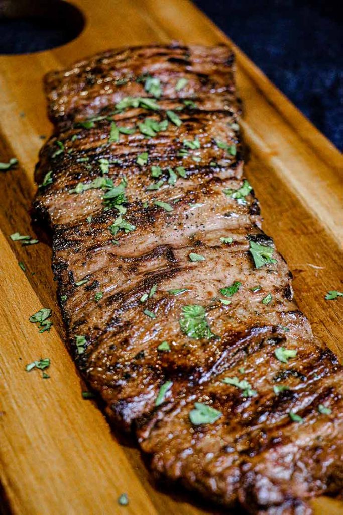 seared skirt steak resting on a cutting board
