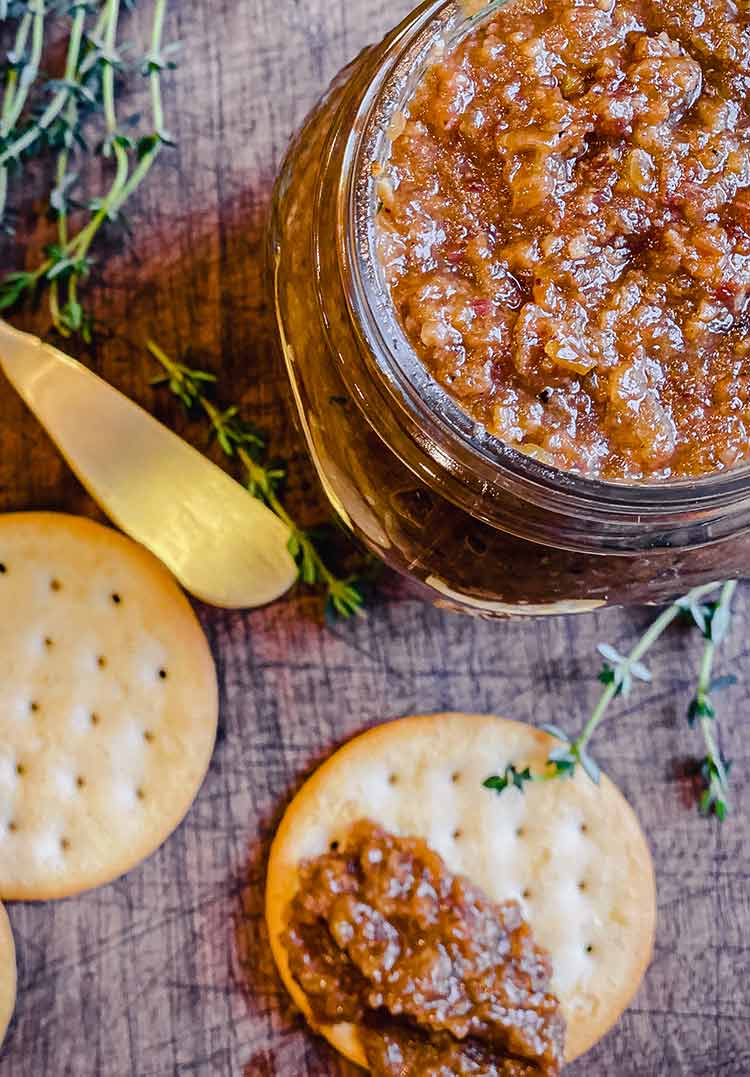 bacon jam in mason jar with cracker