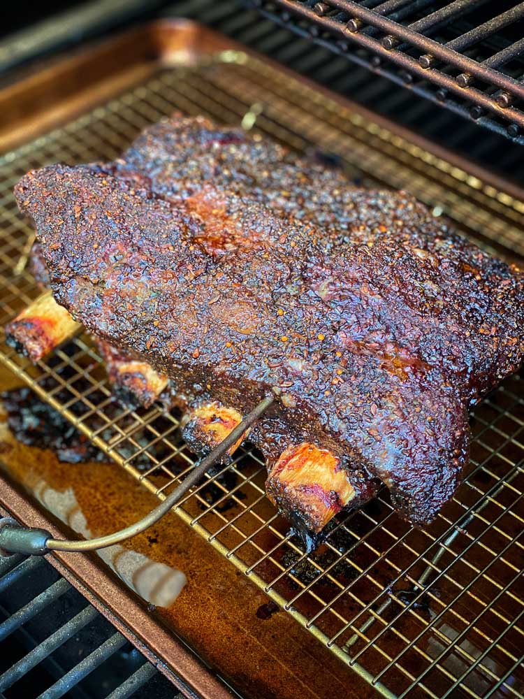 beef ribs on pellet grill with temperature probe