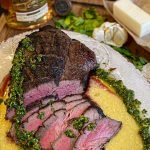 sliced london broil steak with chimichurri