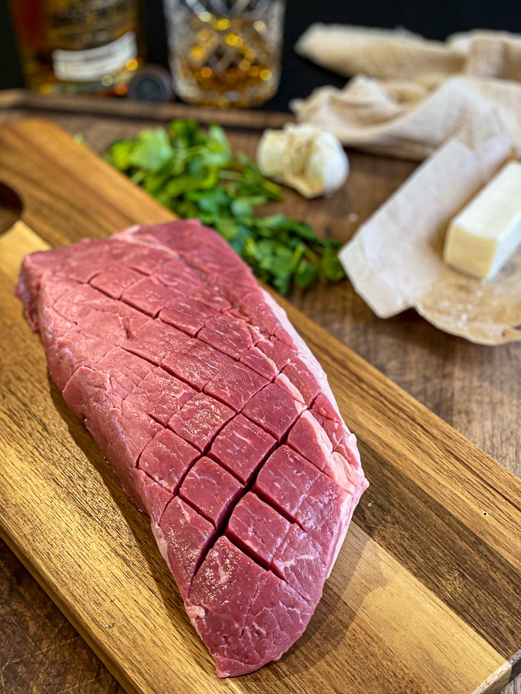 london broil steak scored in diamond pattern