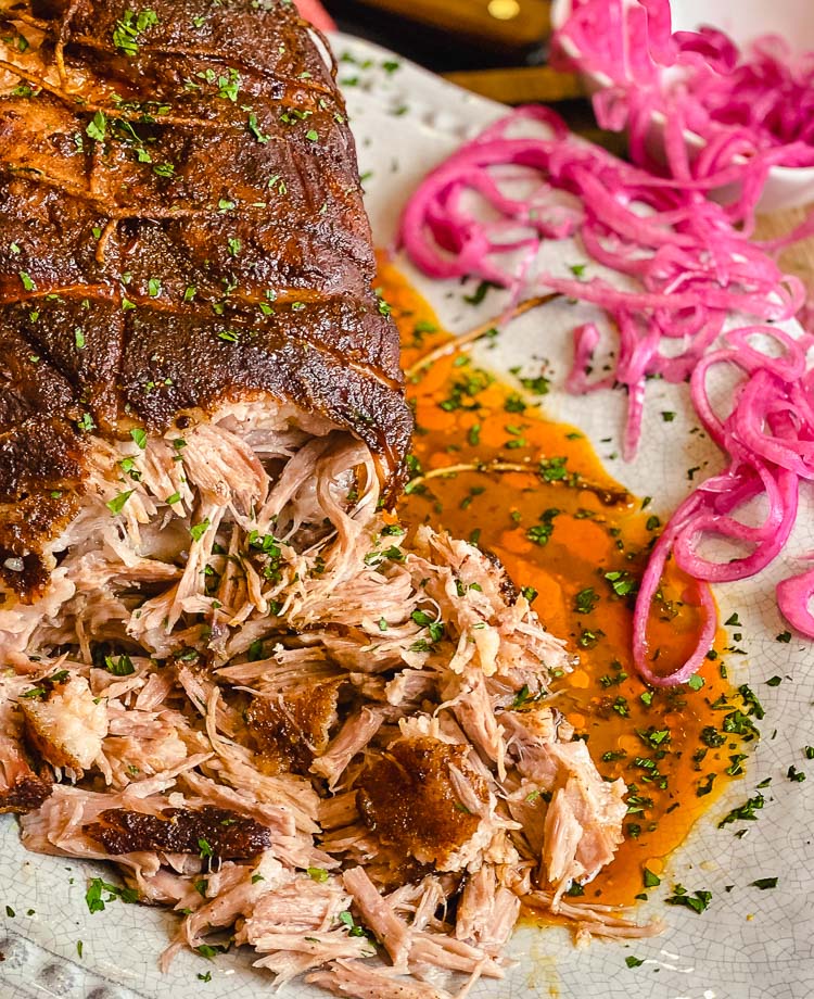 smoked pork shoulder with pickled red onions