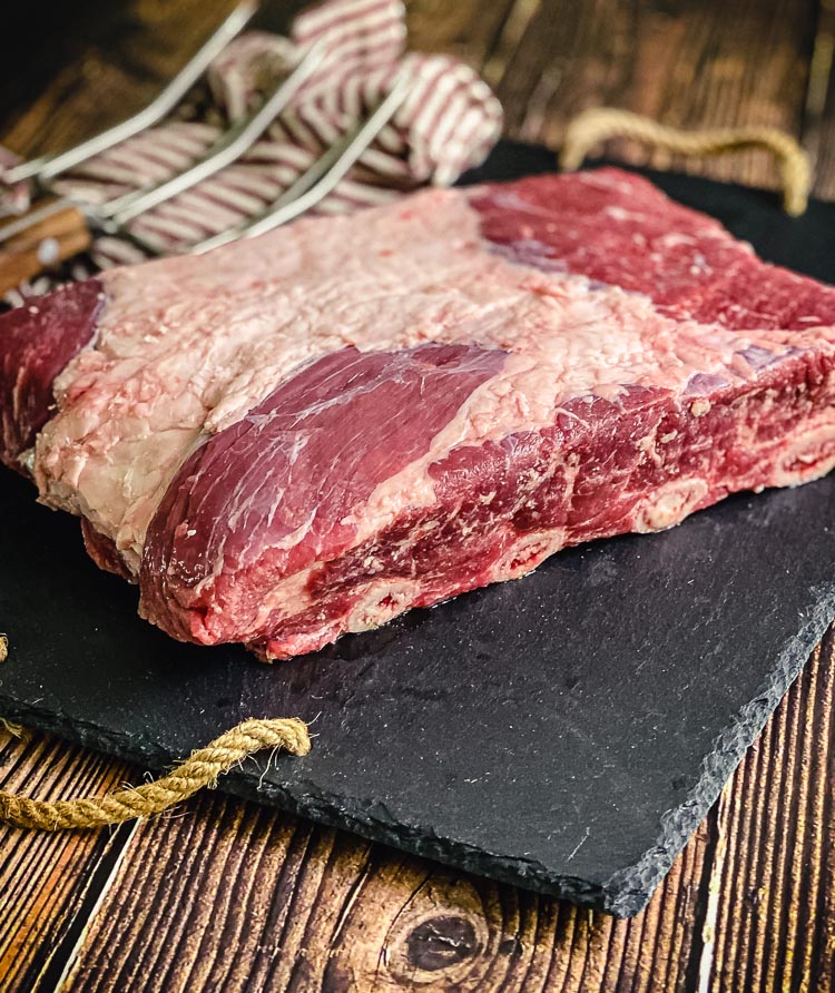 raw beef plate short ribs on cutting board