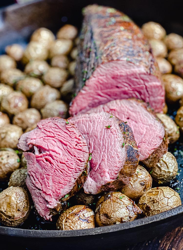 sliced chateaubriand roast in cast iron pan