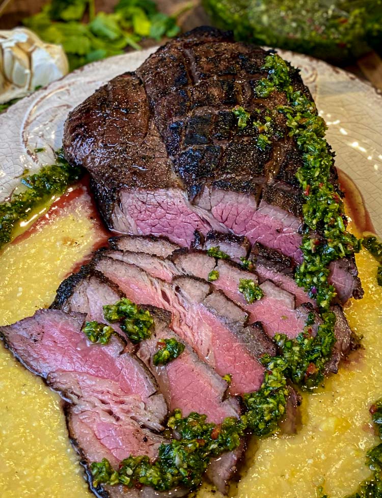 sliced steak with chimichurri