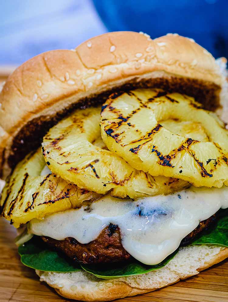 Turkey burger loaded with pineapple, teriyaki sauce, and cheese