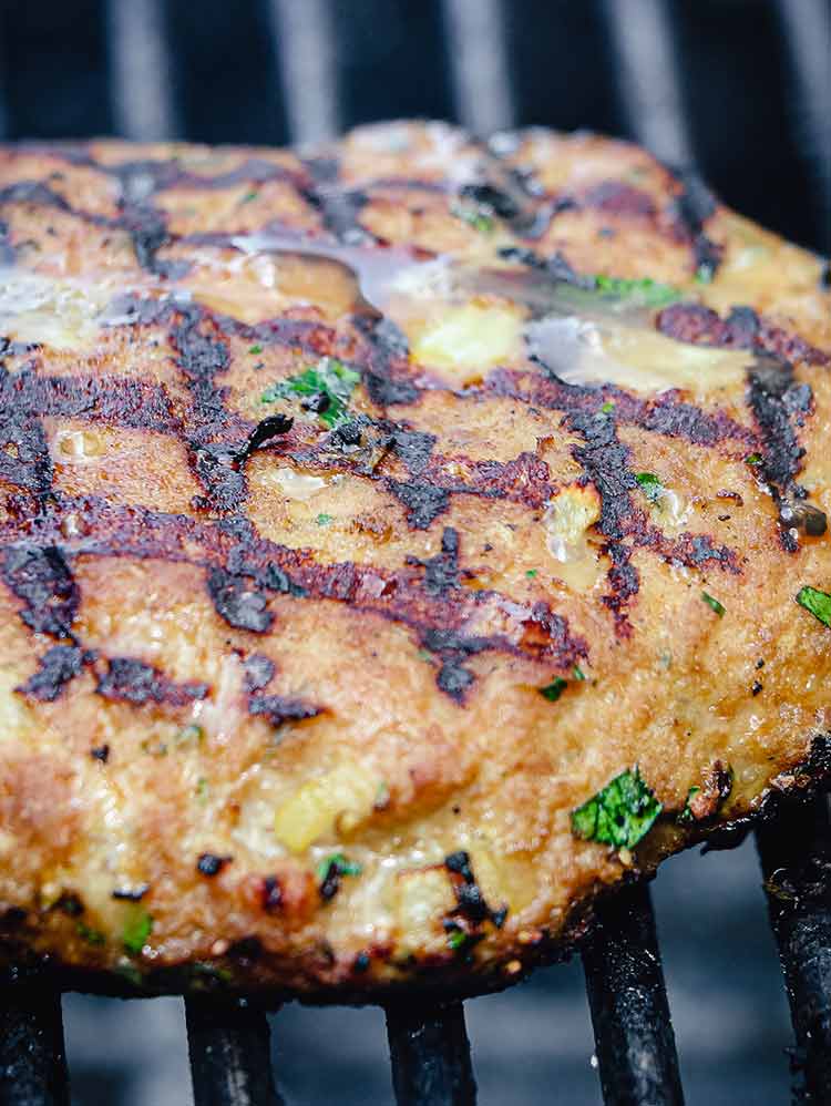 closeup of turkey burger on a grill