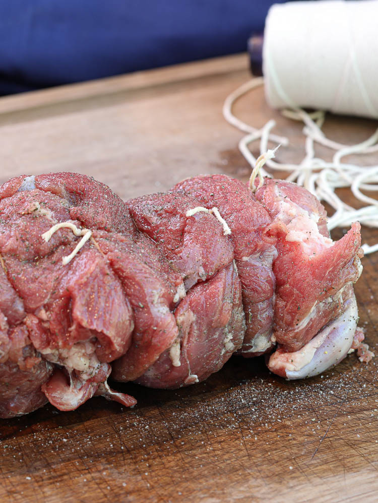 uncooked and tied boneless leg of lamb