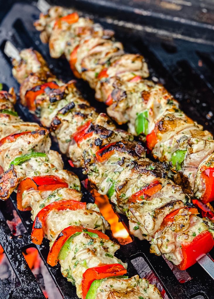 charred grilled chicken kabobs on the grill