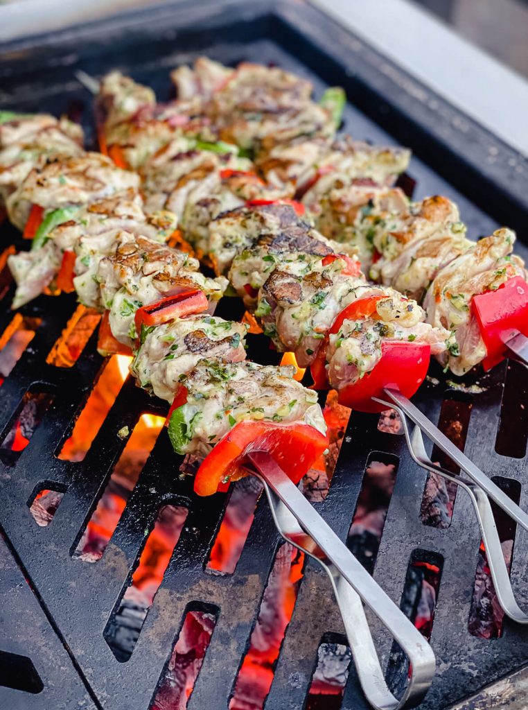 grilled chicken kabobs on the grill over direct heat