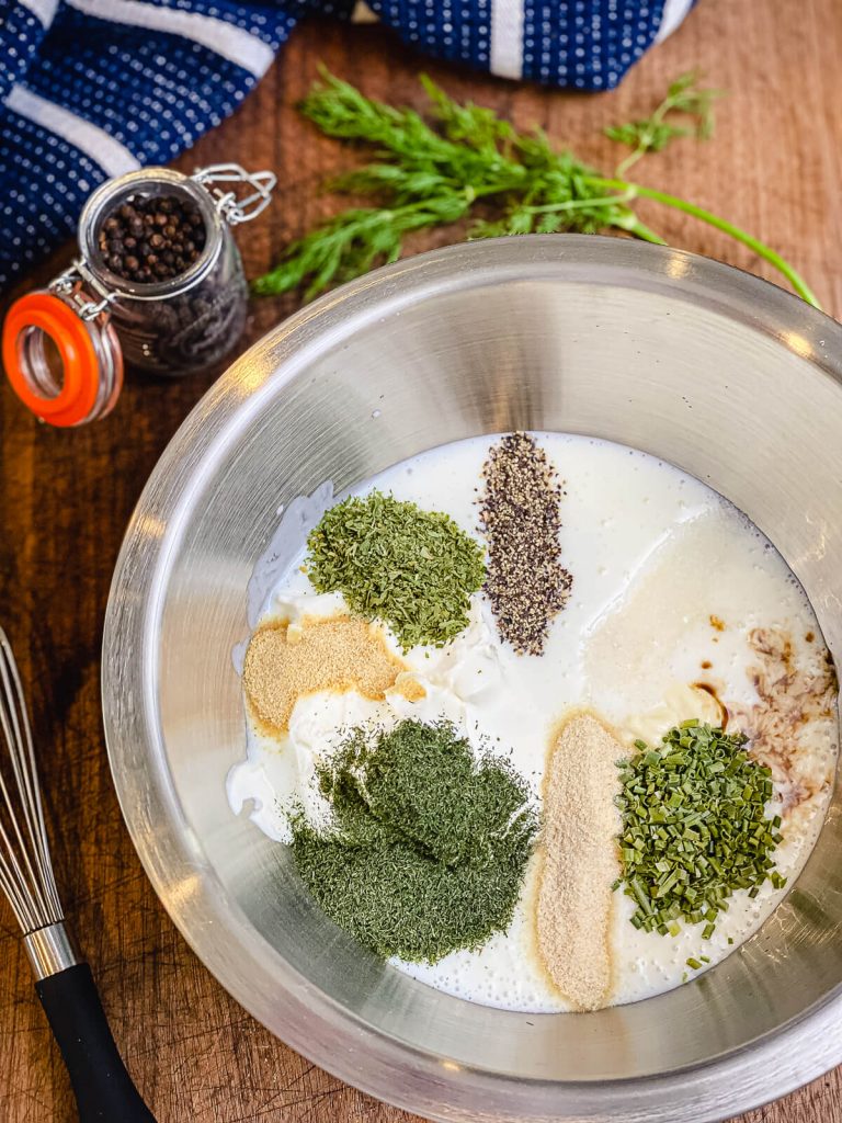 herbs for homemade buttermilk ranch dressing in a bowl, ready to be mixed.