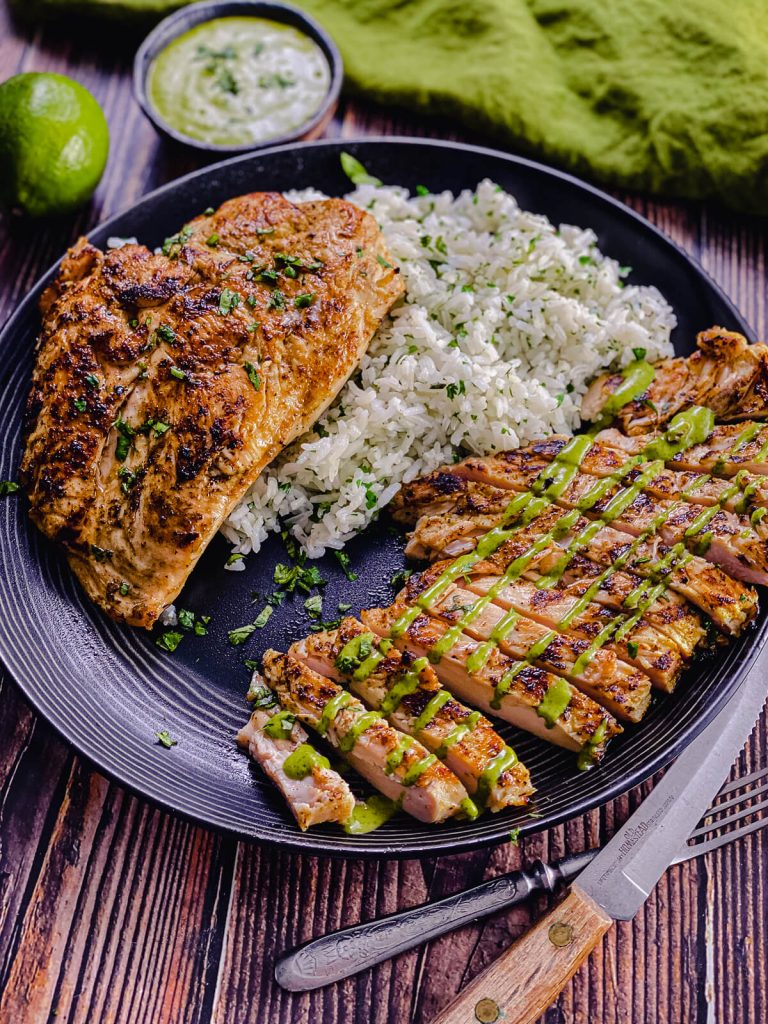 juicy grilled chicken breast served with rice