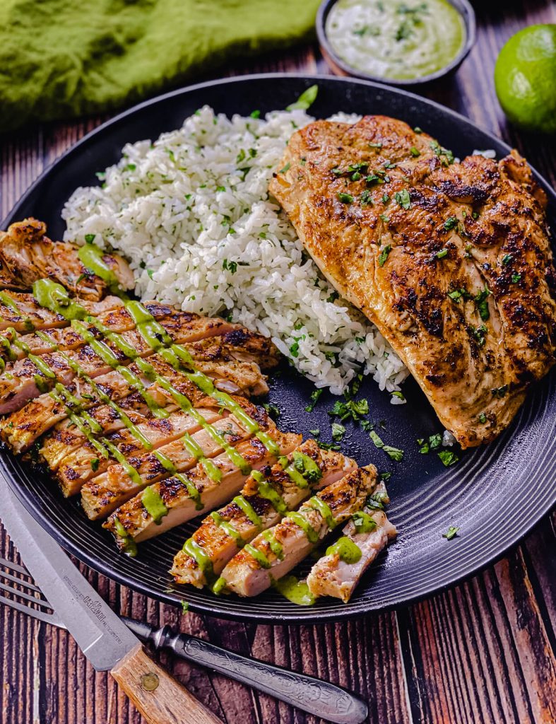 sliced juicy grilled chicken breast with rice