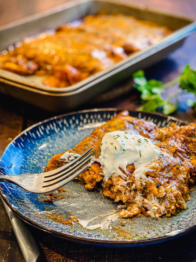 smoked chicken and cheese enchiladas on a plate