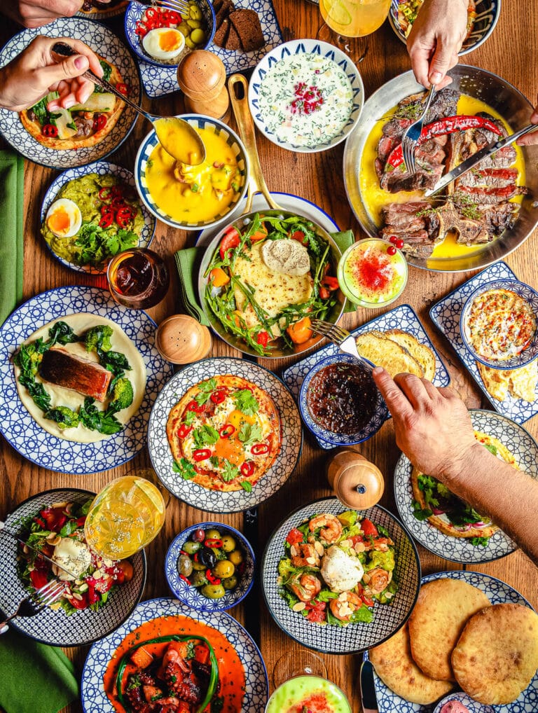 festive table loaded with Mexican food for Cinco de Mayo