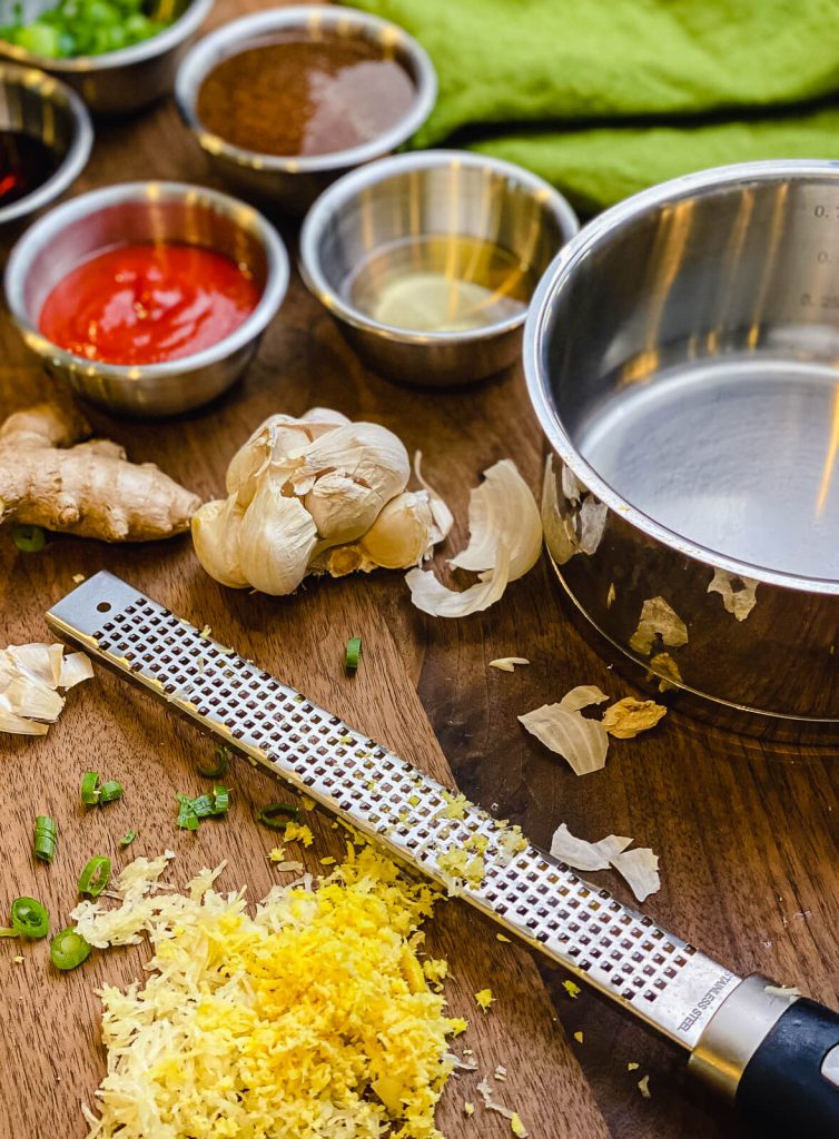 ingredients for sriracha sauce on a cutting board