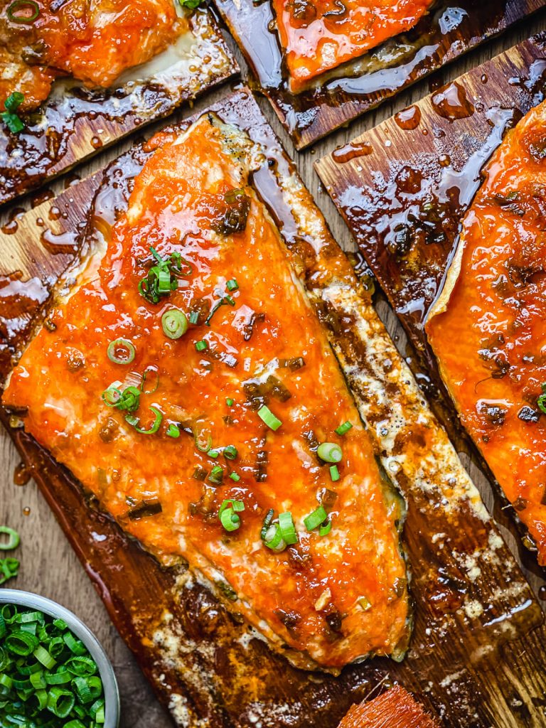 cedar plank salmon topped with green onions