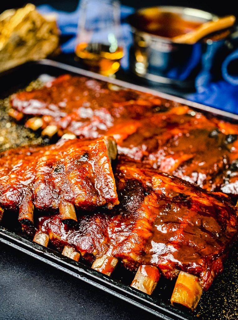 half racks of pork ribs on a platter