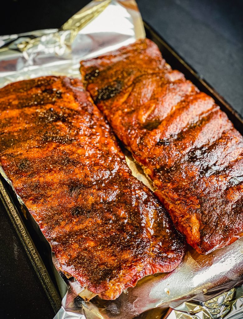 pork ribs one a baking sheet after being cooked 