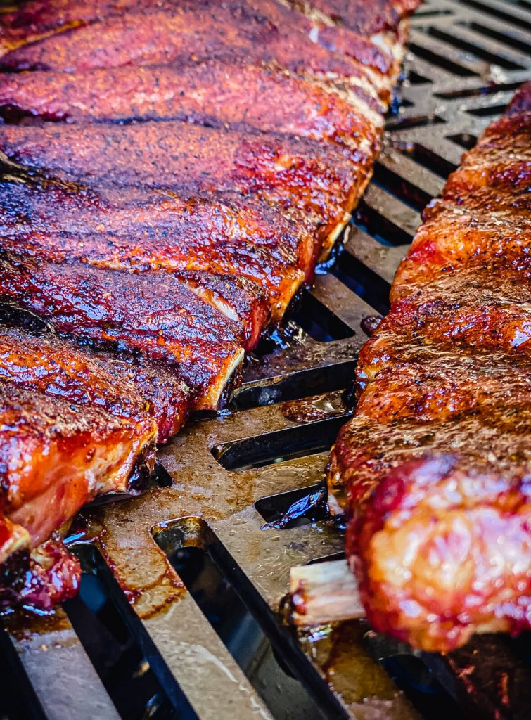 bones on a rack of pork ribs starting to peek out