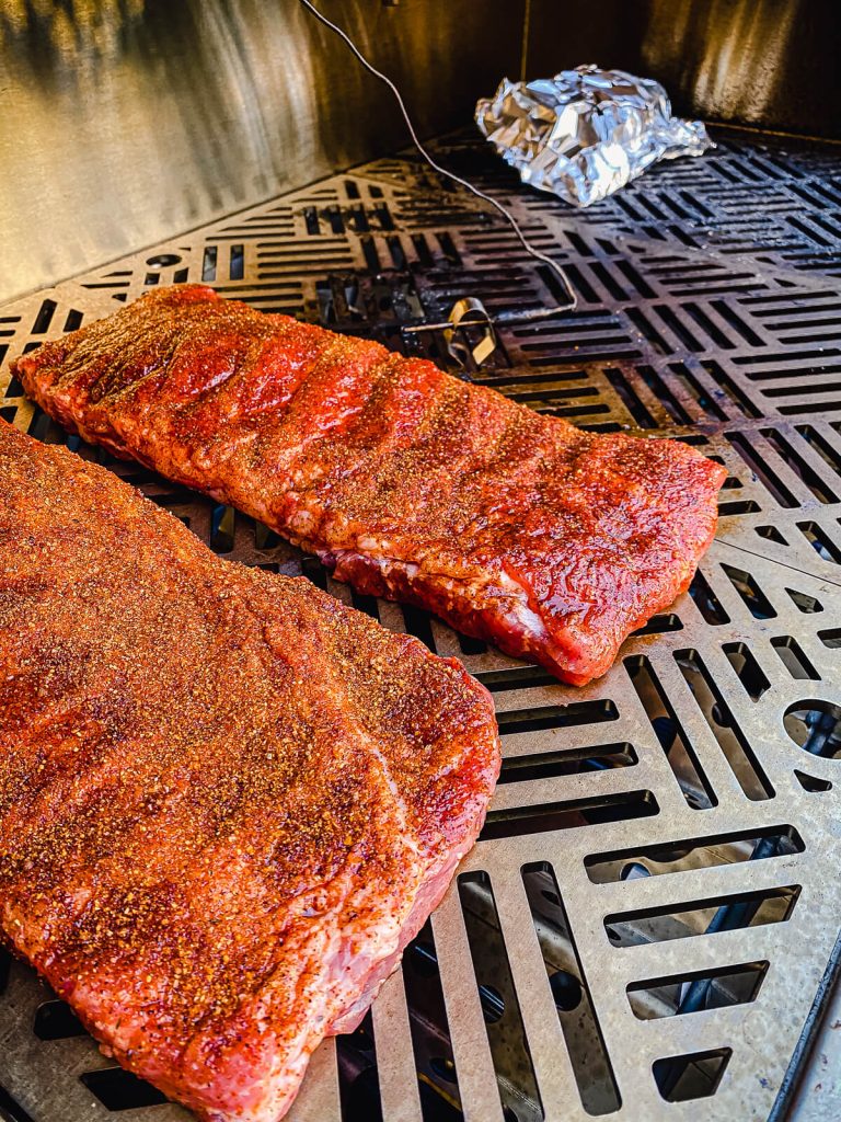 pork ribs cooking on a gas grill