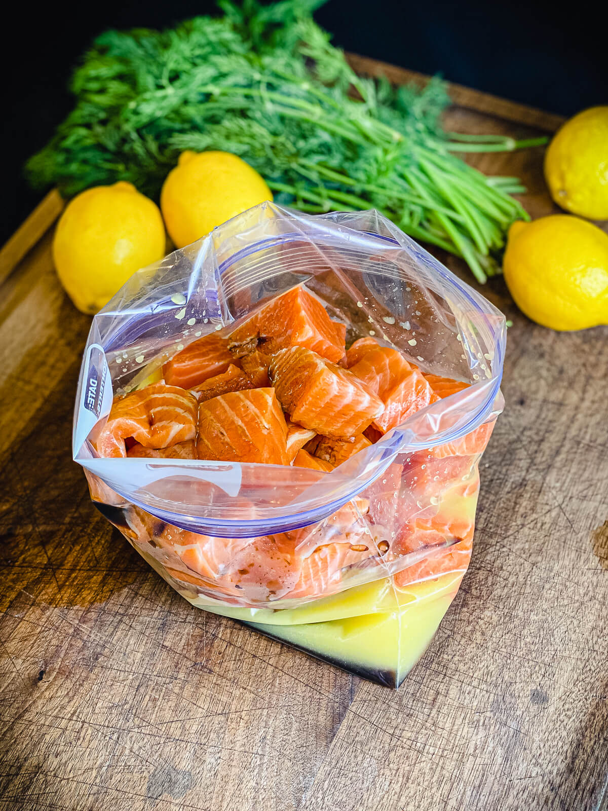 salmon sitting in marinade for salmon kabobs