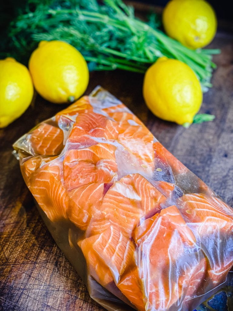 salmon pieces sealed in a bag of marinade 