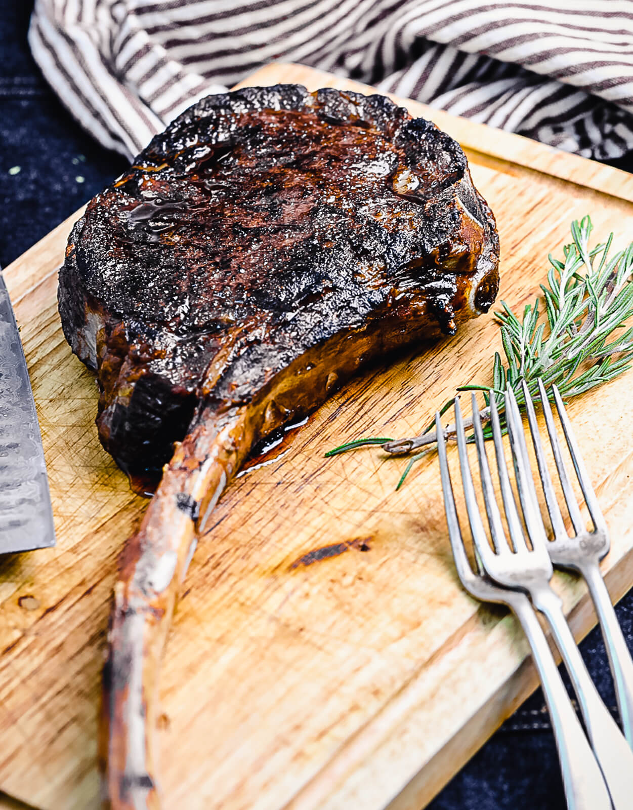 tomahawk ribeye on a wood cutting board