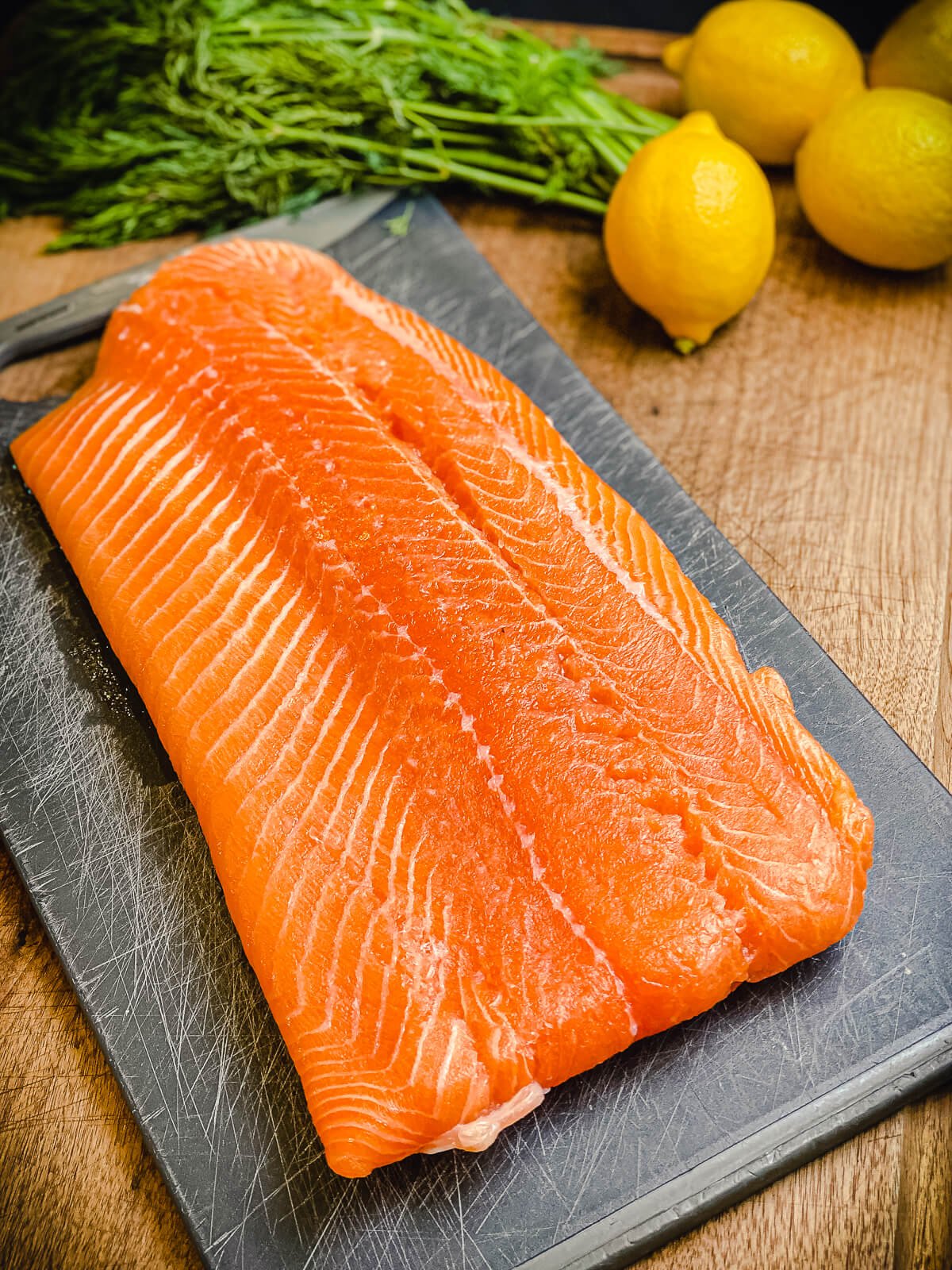 large salmon filet on a cutting board