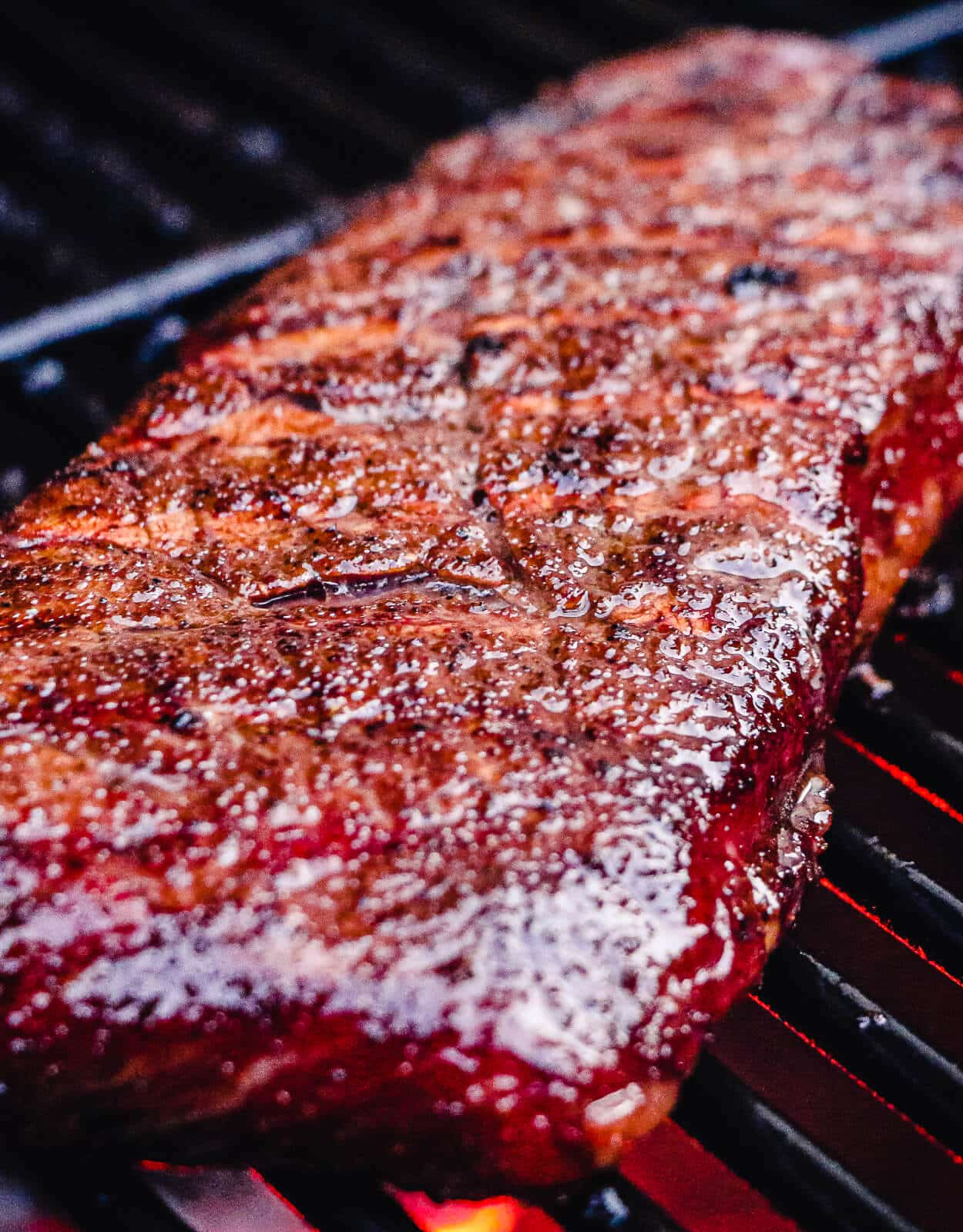 Boston strip steak on a grill