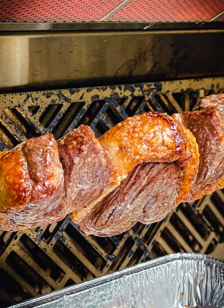 picanha being roasted on a rotisserie