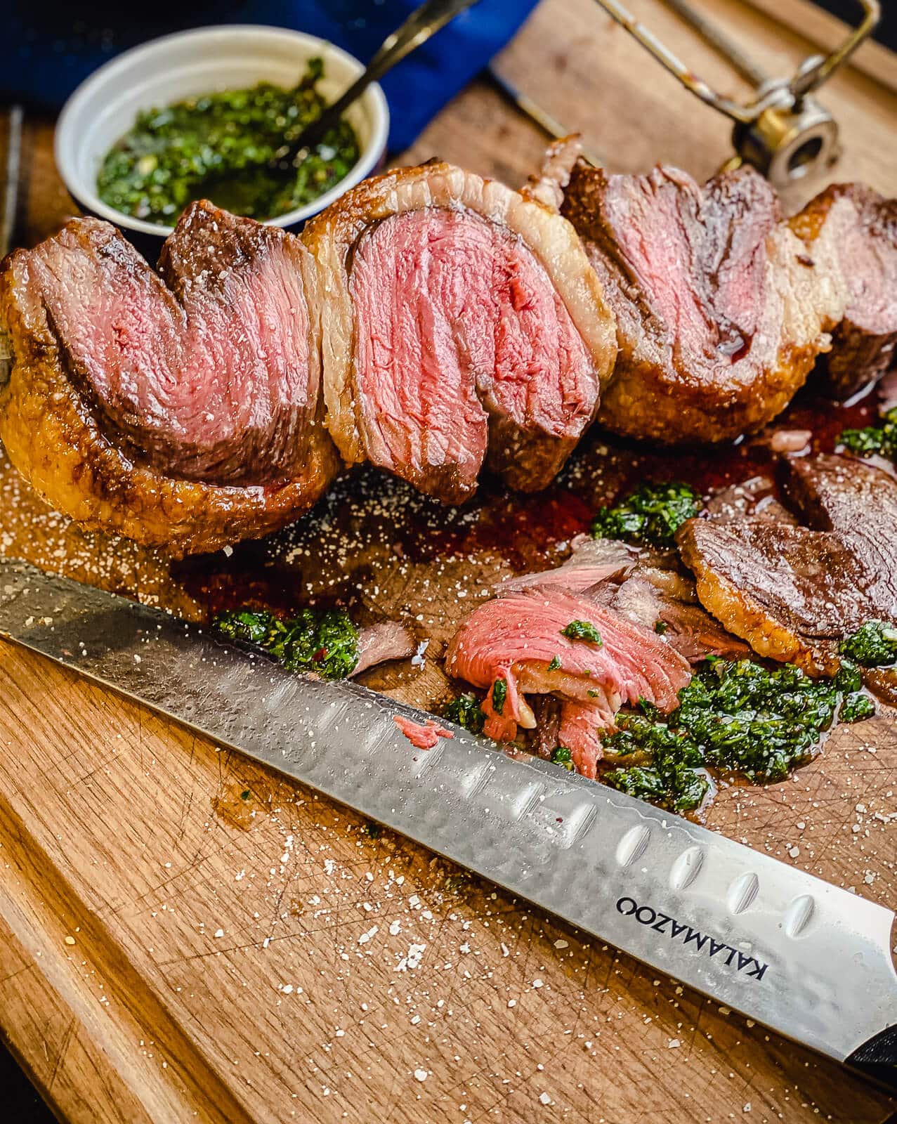 Sliced picanha on a rotisserie spit