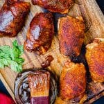 smoked chicken thighs on a serving platter