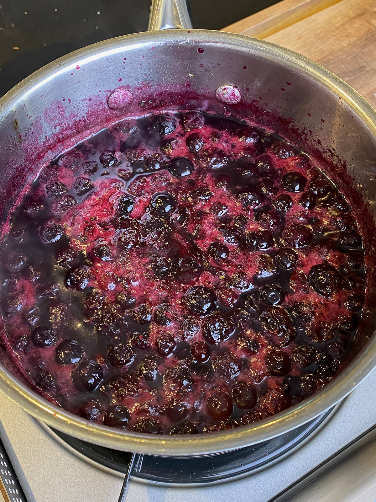cooked blueberries in a saucepan