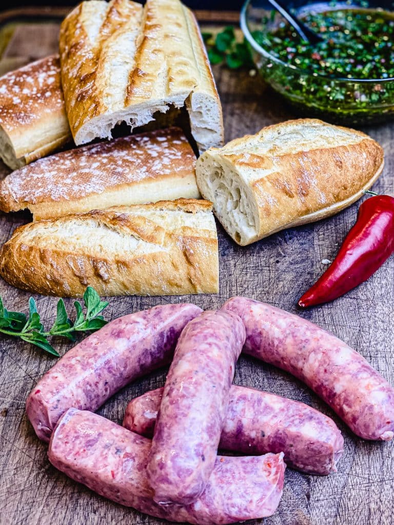 ingredients for choripan on a cutting board