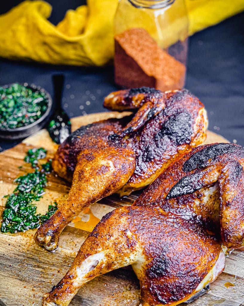 Grilled chicken halves with chimichurri