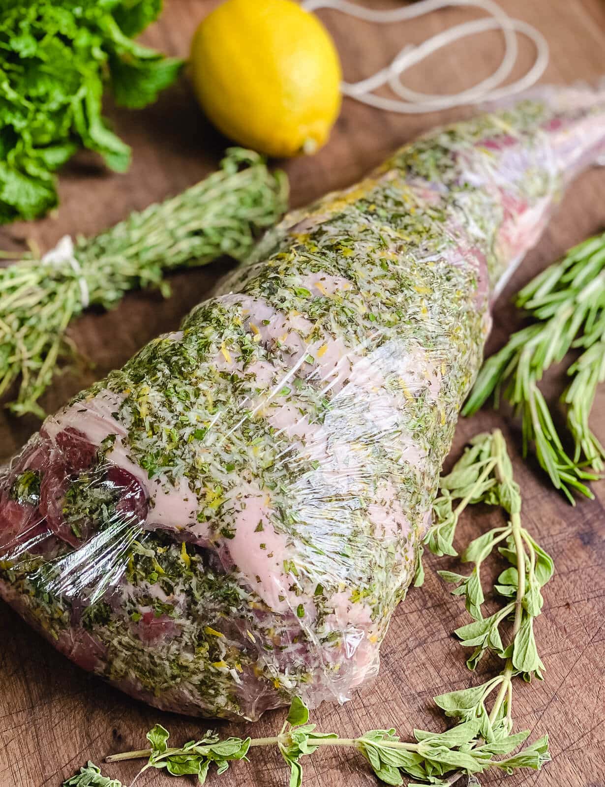 leg of lamb wrapped in plastic wrap