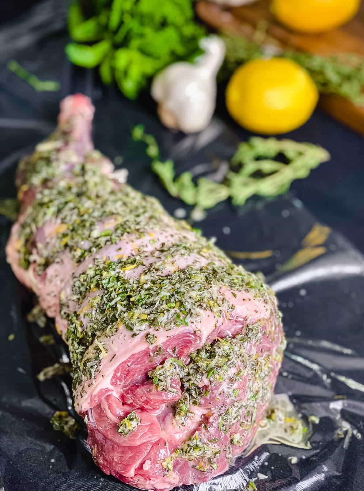 herb paste covering leg of lamb