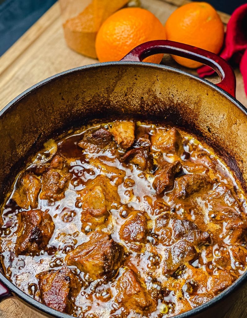 pork carnitas right off the grill and still braising in rendered pork fat 