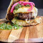 provoleta burger on a cutting board