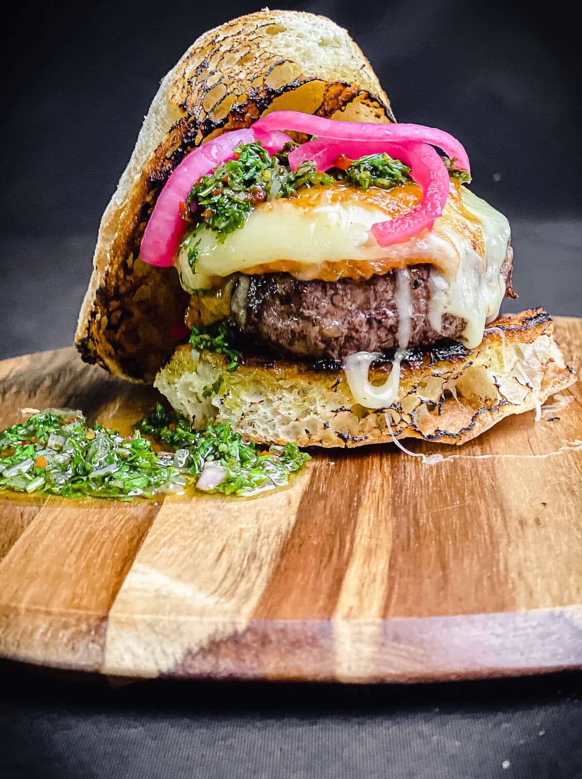 provoleta burger on a cutting board