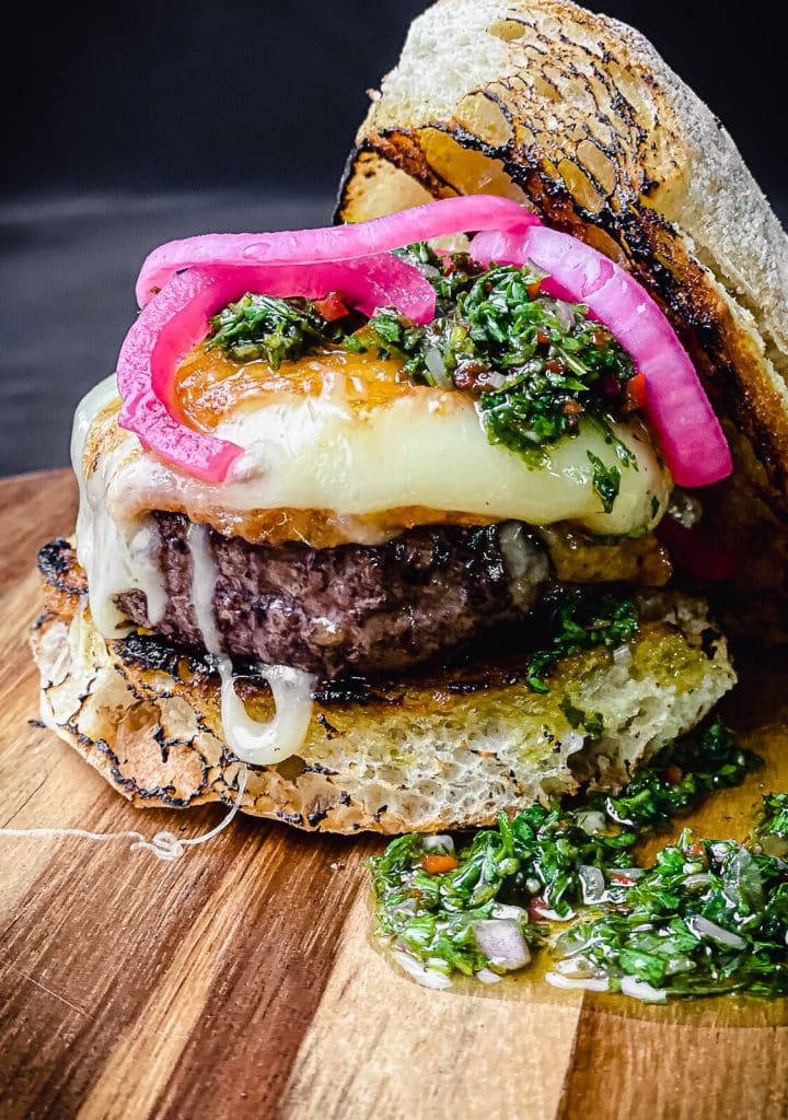 provoleta burger with pickled red onions and chimichurri