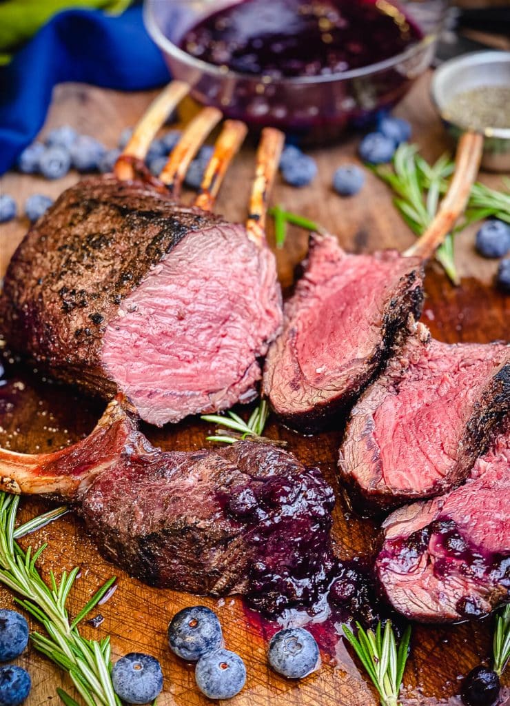 grilled rack of venison sliced and served with blueberry sauce