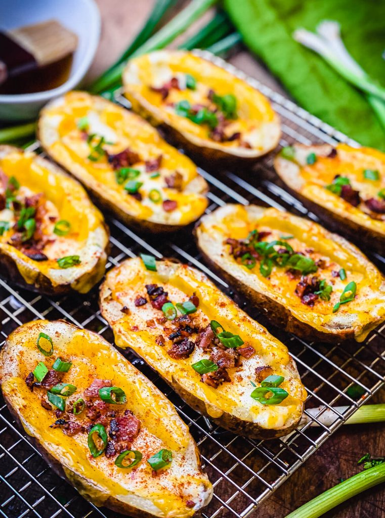 baked potato skins sitting on a wire rack