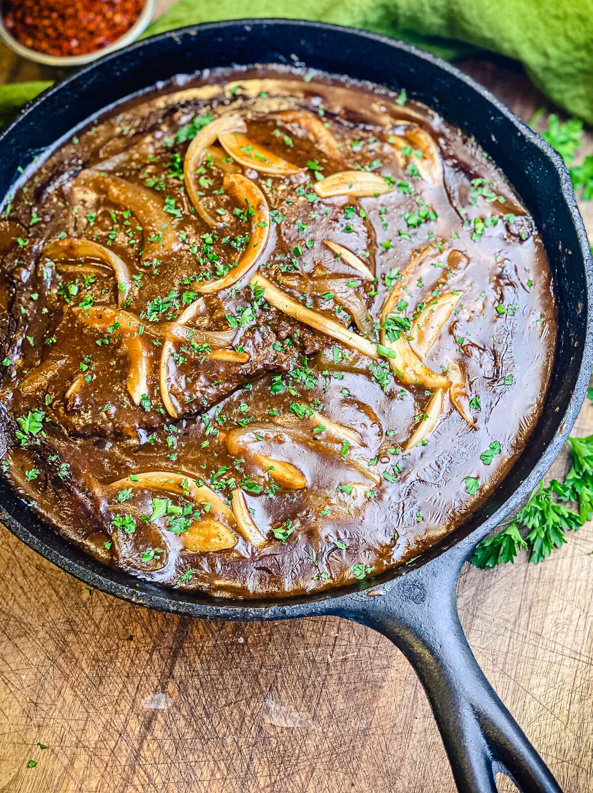 cube steaks in a cast iron pan