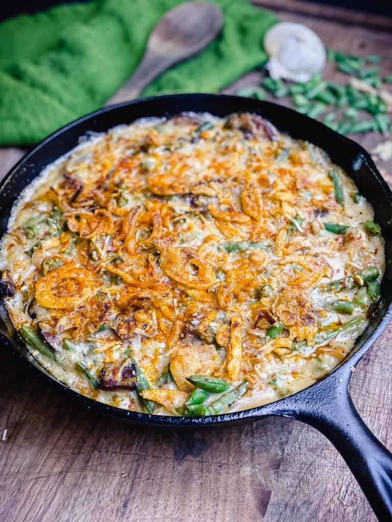 smoked green bean casserole in a cast iron pan